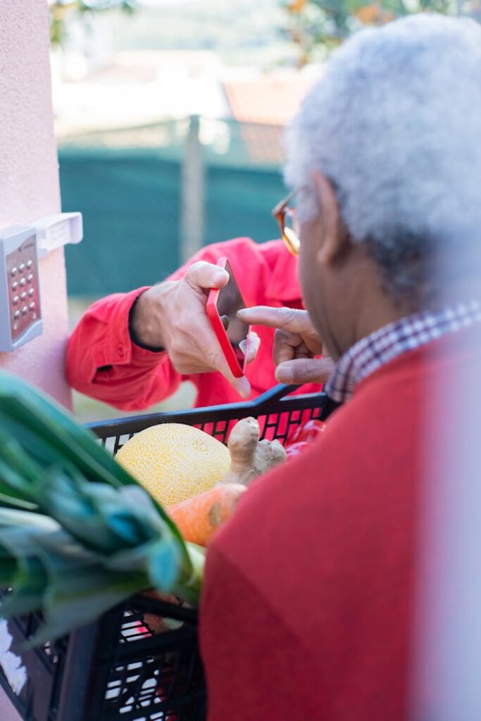 
An Elderly Man Touching a Smartphone